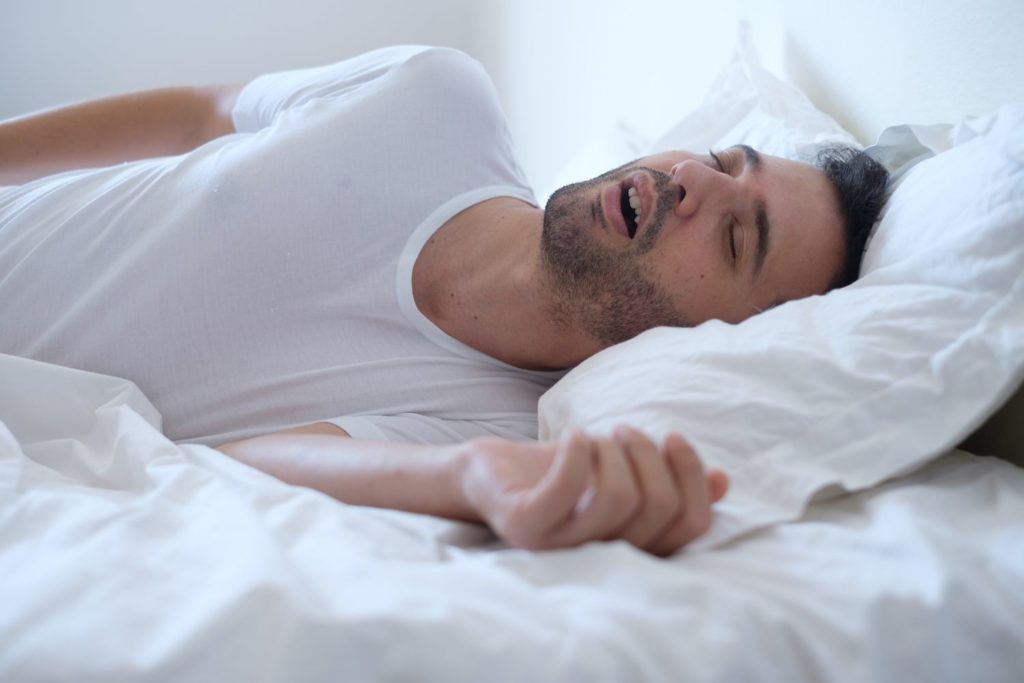 Man snoring while sleeping sleep apnea dentist in Acton Massachusetts 
